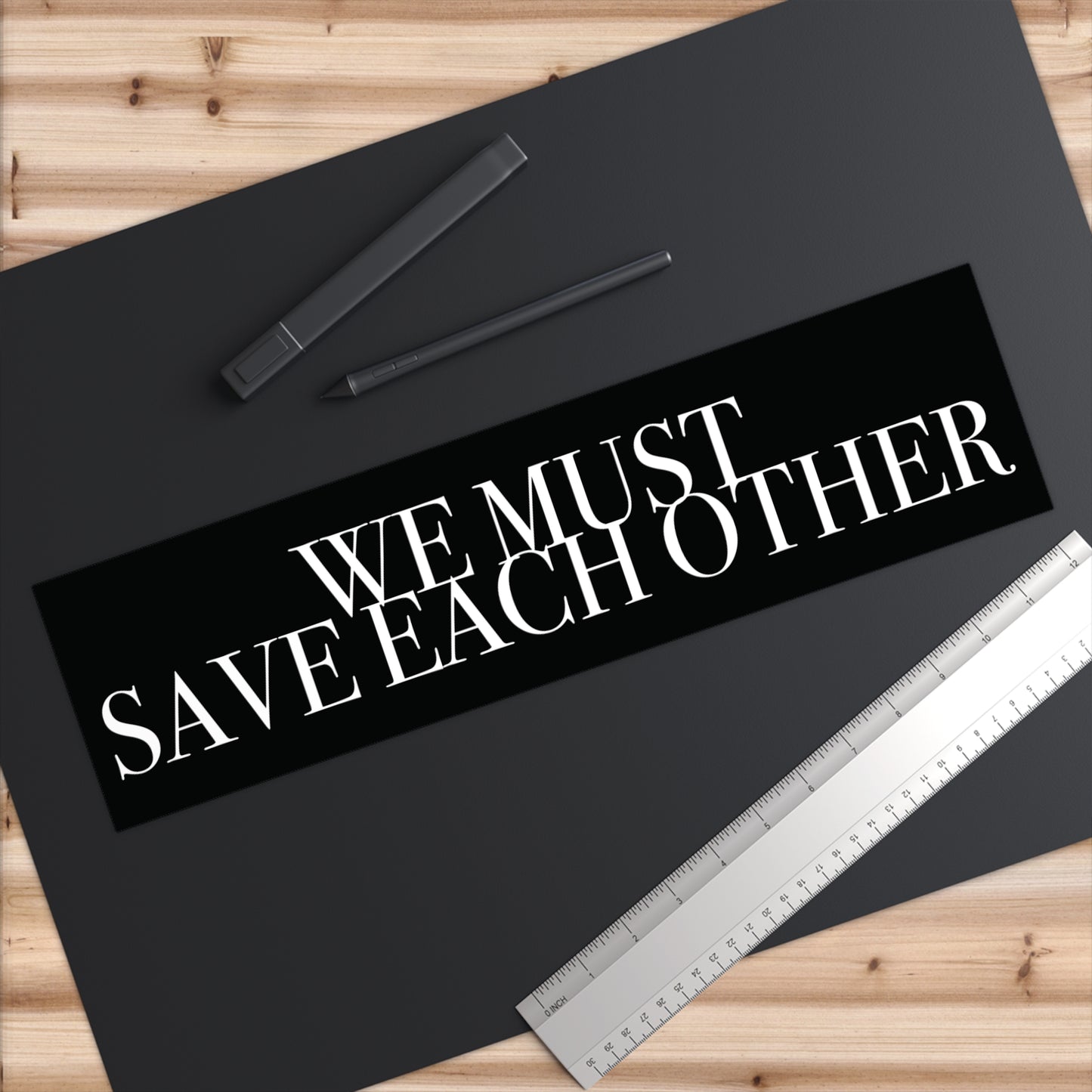 "We Must Save Each Other" Bumper Sticker
