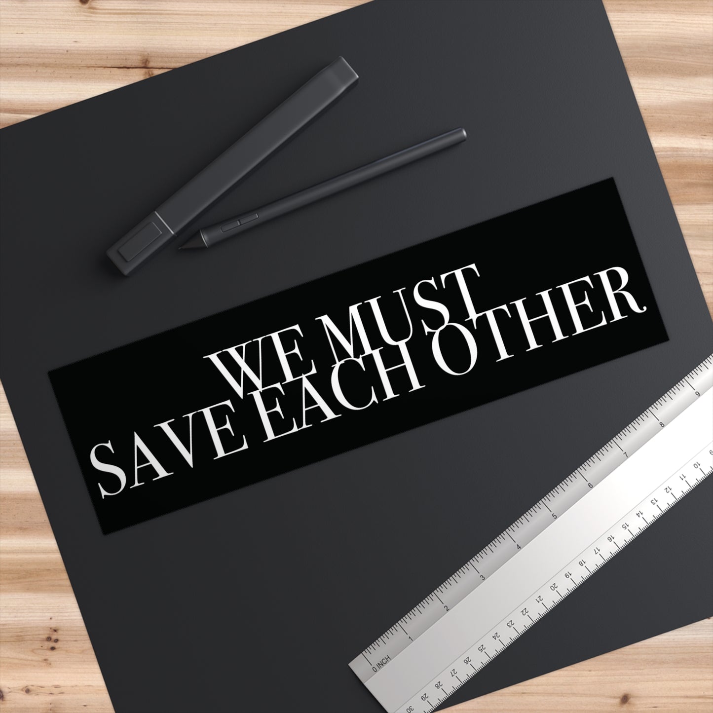 "We Must Save Each Other" Bumper Sticker